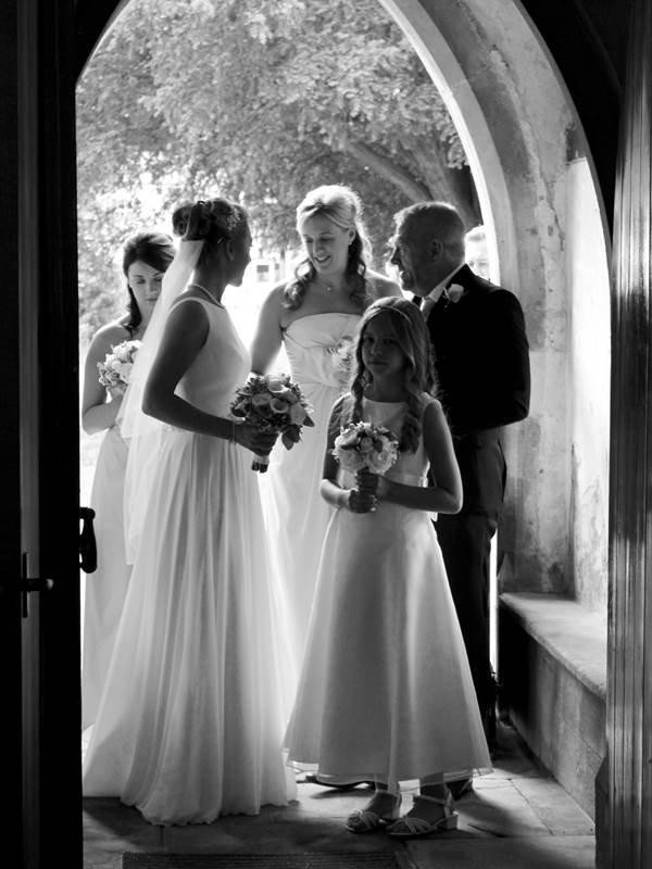 Sarah arrives at the church silhouetted by the light